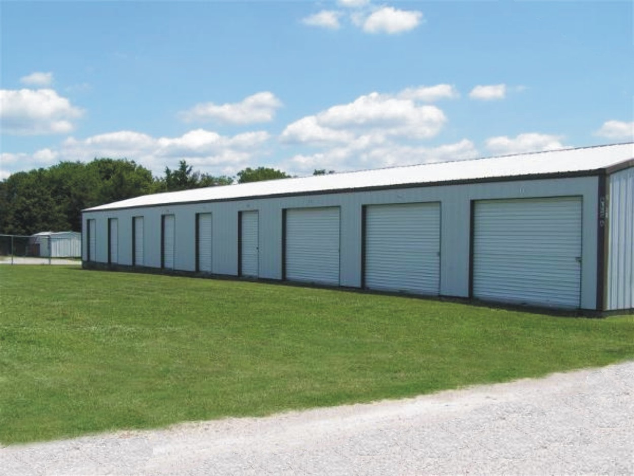 One of Our Many, Well Kept Storage Buildings Road Sign